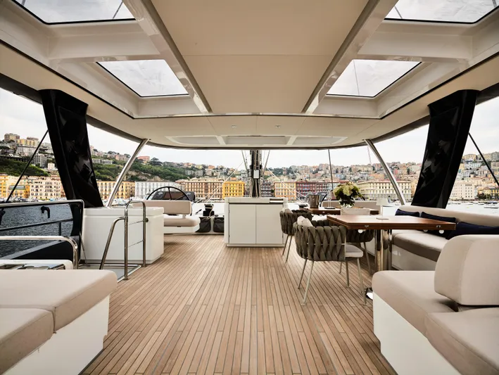 Kajikia Yacht Photos Pics Luxurious 2023 Lagoon 77 yacht interior with panoramic views and elegant seating.