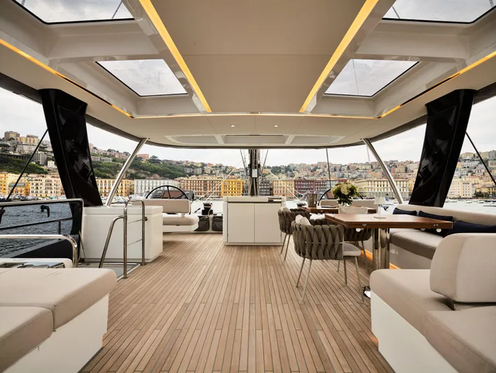 Kajikia Yacht Photos Pics Luxurious interior of 2023 Lagoon 77 yacht with spacious seating and scenic views.