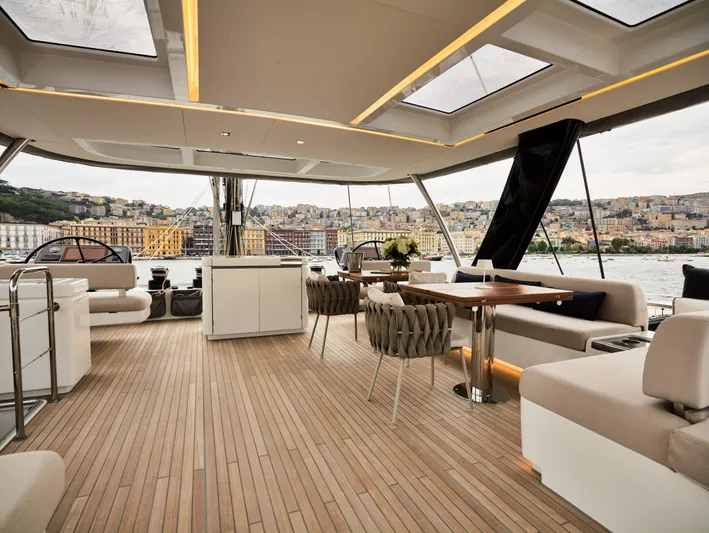 Kajikia Yacht Photos Pics Luxurious 2023 Lagoon 77 yacht interior with elegant seating and panoramic views.