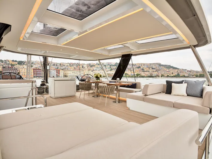 Kajikia Yacht Photos Pics Luxurious 2023 Lagoon 77 yacht interior with spacious seating and elegant design.