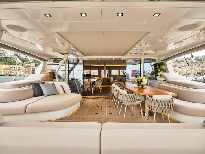 Kajikia Yacht Photos Pics Luxurious interior of 2023 Lagoon 77 yacht with elegant seating and dining area.