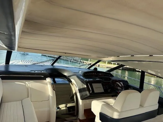 Everything 4 Sail Yacht Photos Pics Interior of 2006 Princess 58v yacht with modern dashboard and seating.