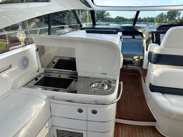 Everything 4 Sail Yacht Photos Pics Interior of 2006 Princess 58v yacht with sleek kitchen and seating area.
