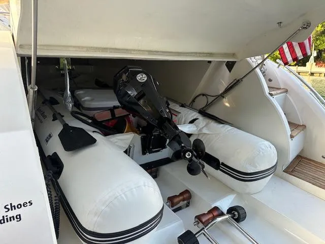 Everything 4 Sail Yacht Photos Pics 2006 Princess 58v yacht with inflatable dinghy and outboard motor in storage compartment.