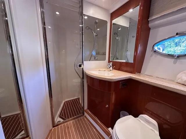 Everything 4 Sail Yacht Photos Pics Luxurious bathroom in 2006 Princess 58v yacht with shower, sink, and toilet.