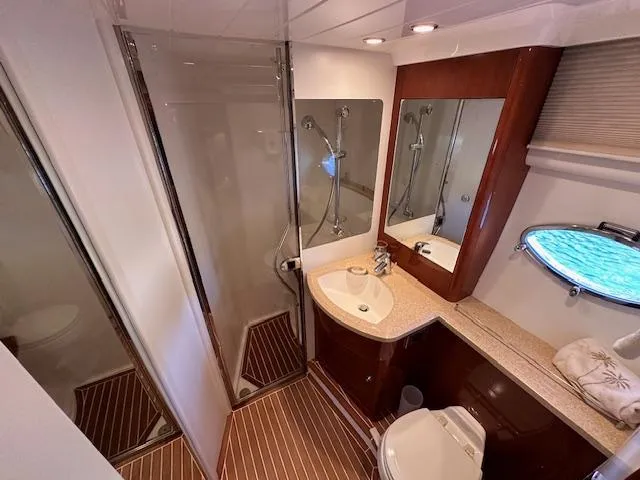 Everything 4 Sail Yacht Photos Pics Luxurious bathroom in 2006 Princess 58v yacht with shower and vanity.
