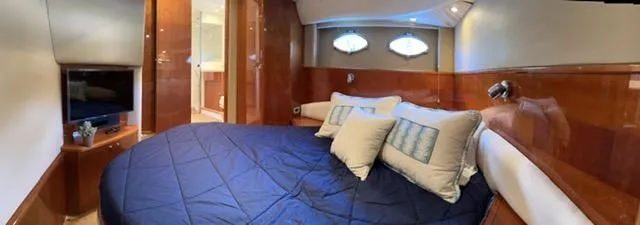 Everything 4 Sail Yacht Photos Pics Luxurious cabin interior of 2006 Princess 58v yacht with cozy bedding and modern amenities.