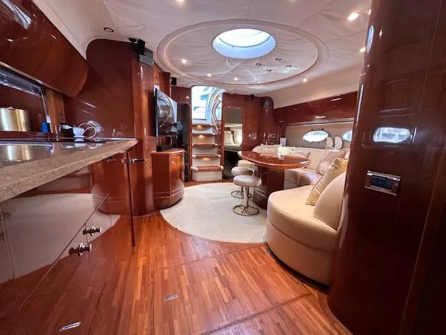 Everything 4 Sail Yacht Photos Pics Luxurious interior of 2006 Princess 58v yacht with elegant wood finishes and modern amenities.
