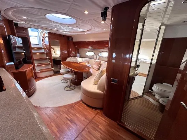 Everything 4 Sail Yacht Photos Pics Luxurious interior of 2006 Princess 58v yacht with elegant wood finishes and modern amenities.