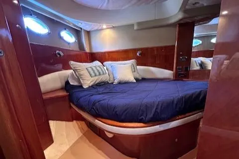 Everything 4 Sail Yacht Photos Pics Luxurious cabin interior of 2006 Princess 58v yacht with plush bedding.