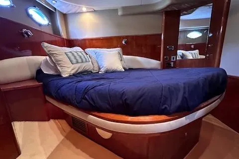 Everything 4 Sail Yacht Photos Pics Luxurious cabin interior of 2006 Princess 58v yacht with elegant bedding.