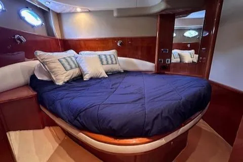 Everything 4 Sail Yacht Photos Pics Luxurious cabin interior of 2006 Princess 58v yacht with cozy bedding.