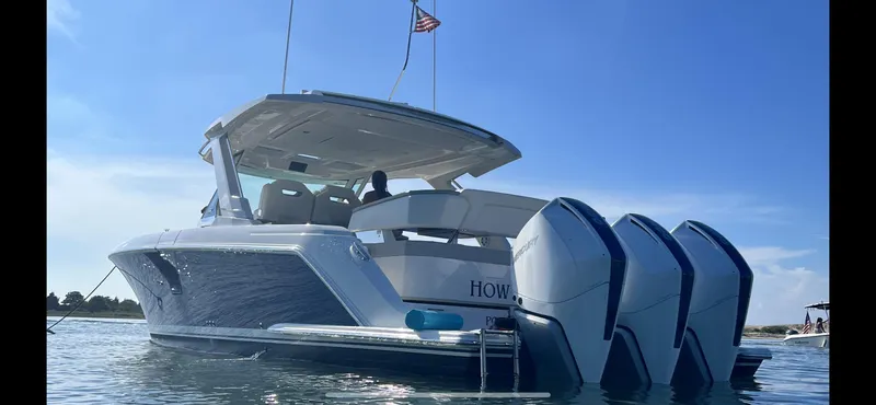  Yacht Photos Pics 2023 Tiara Yachts 38 LS with triple engines on calm water.