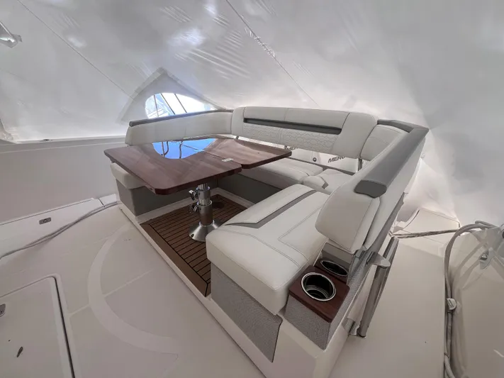  Yacht Photos Pics 2023 Tiara Yachts 38 LS interior with elegant seating and wooden table.