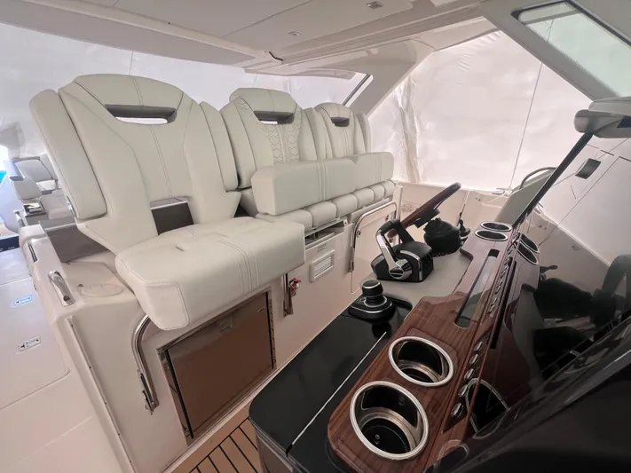  Yacht Photos Pics 2023 Tiara Yachts 38 LS interior with luxurious seating and modern helm controls.