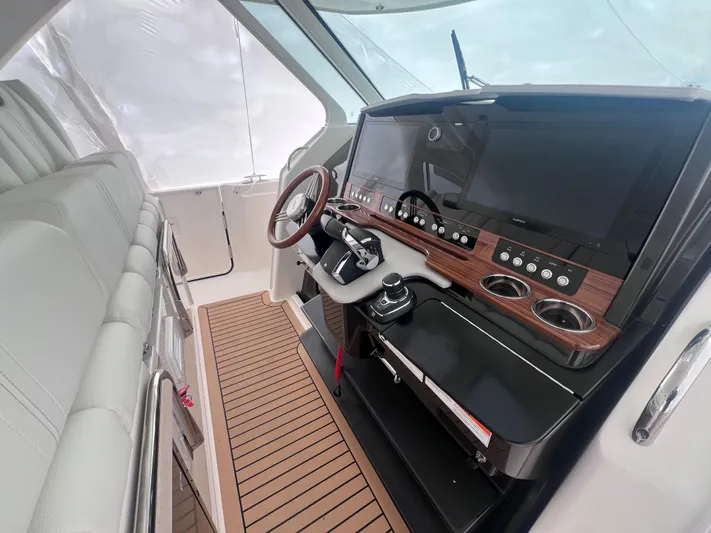  Yacht Photos Pics 2023 Tiara Yachts 38 LS helm with modern controls and sleek design.