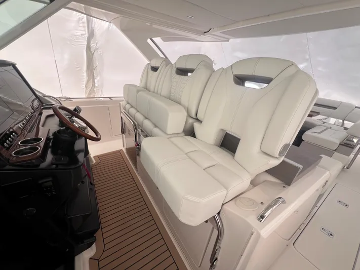  Yacht Photos Pics 2023 Tiara Yachts 38 LS interior with luxurious seating and modern helm design.