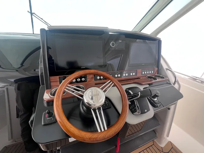  Yacht Photos Pics 2023 Tiara Yachts 38 LS helm with dual screens and wooden steering wheel.