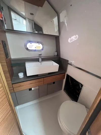  Yacht Photos Pics 2023 Tiara Yachts 38 LS bathroom with modern sink and toilet.
