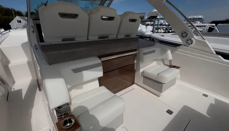  Yacht Photos Pics 2023 Tiara Yachts 38 LS interior with luxurious seating and modern design.