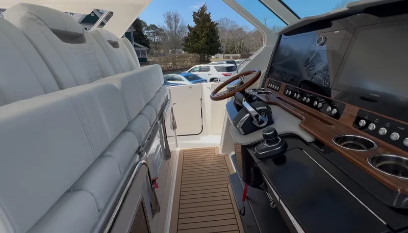  Yacht Photos Pics 2023 Tiara Yachts 38 LS interior with luxurious seating and advanced helm controls.