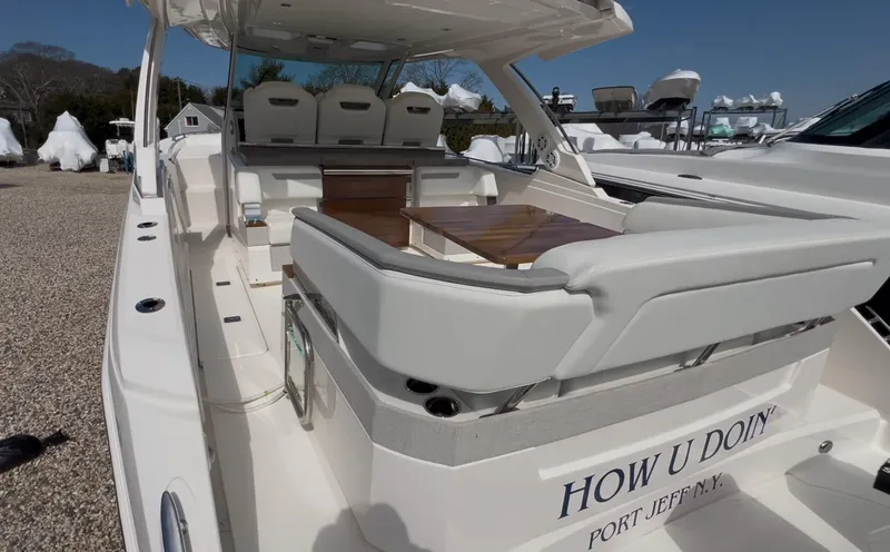  Yacht Photos Pics 2023 Tiara Yachts 38 LS luxury boat with spacious seating and elegant design.