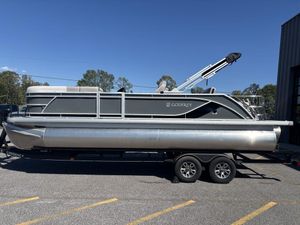 2025 Godfrey Sweetwater 2286 SFLC pontoon boat on a trailer, parked outdoors.