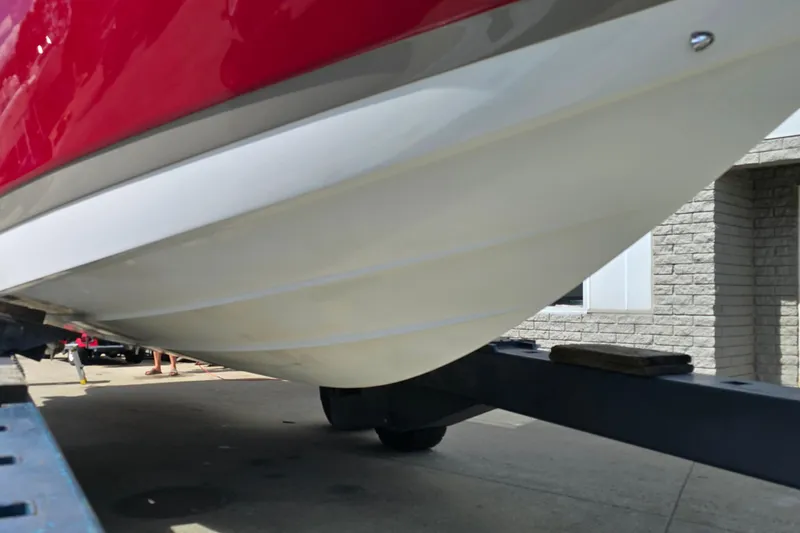  Yacht Photos Pics 2011 Cobalt 323 boat hull on trailer, red and white exterior.