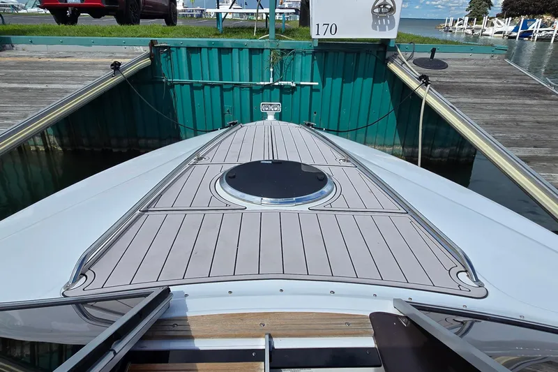  Yacht Photos Pics 2011 Cobalt 323 boat docked, featuring sleek deck design and marina backdrop.