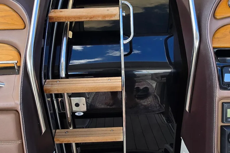  Yacht Photos Pics Stainless steel and wood ladder on 2011 Cobalt 323 boat interior.