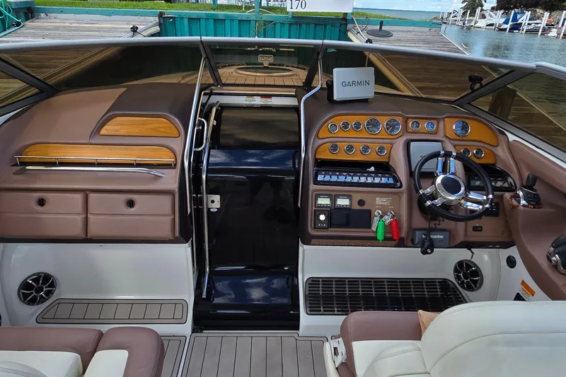  Yacht Photos Pics Interior of a 2011 Cobalt 323 boat with Garmin navigation system and luxurious dashboard.