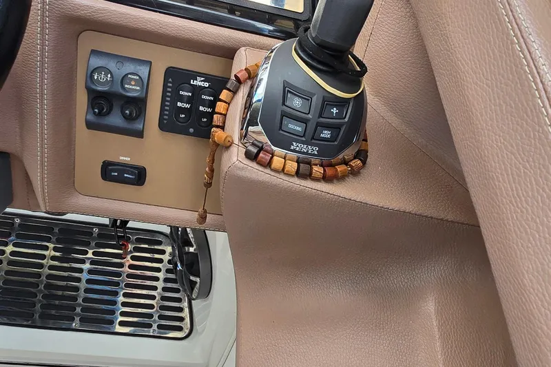  Yacht Photos Pics 2011 Cobalt 323 boat controls with Volvo Penta joystick and Lenco trim tabs.