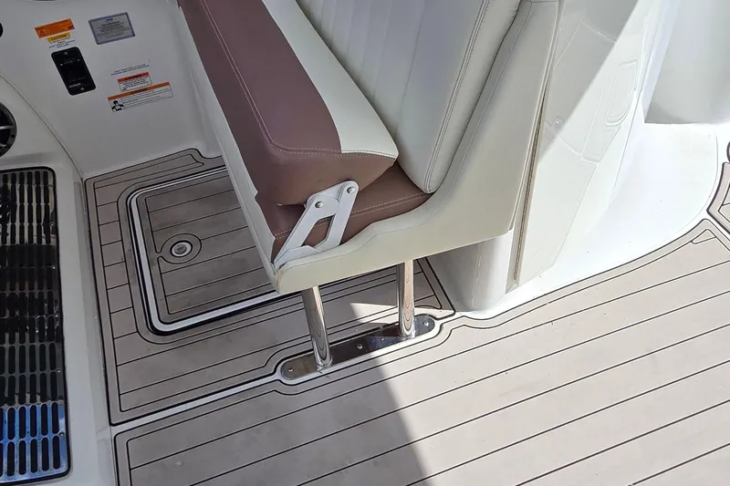  Yacht Photos Pics 2011 Cobalt 323 boat interior with brown and white seating and teak-style flooring.