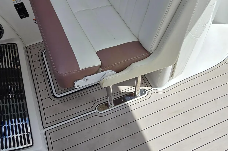  Yacht Photos Pics 2011 Cobalt 323 boat interior with cushioned seating and sleek flooring design.