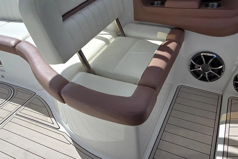  Yacht Photos Pics 2011 Cobalt 323 boat interior with cushioned seating and speaker system.