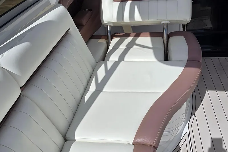  Yacht Photos Pics Luxurious seating on a 2011 Cobalt 323 boat with white and brown upholstery.