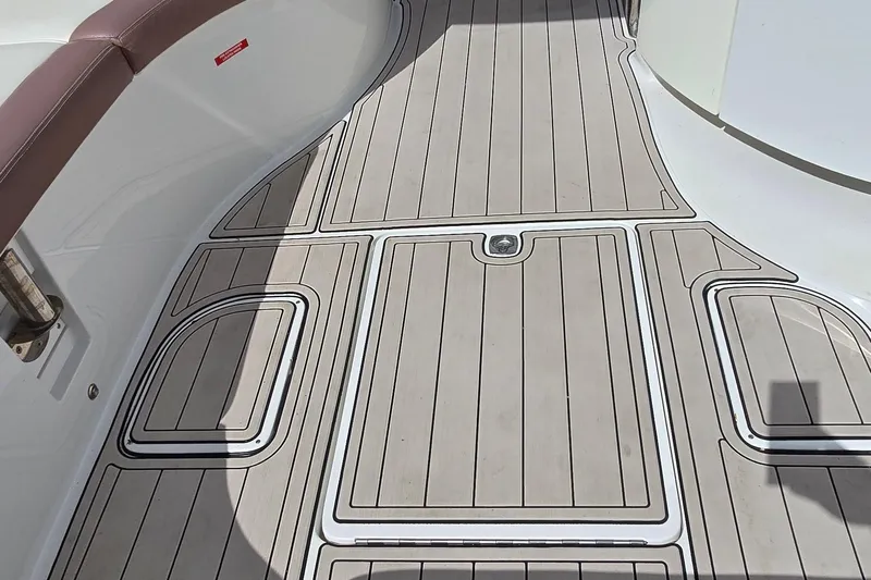  Yacht Photos Pics Cobalt 323 2011 boat deck with sleek, modern design and brown seating.