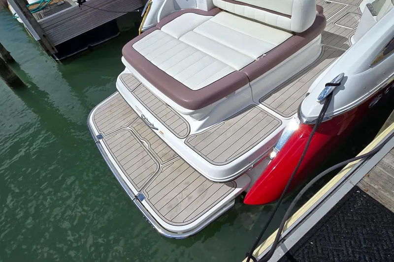  Yacht Photos Pics 2011 Cobalt 323 boat with teak swim platform and cushioned seating at dock.