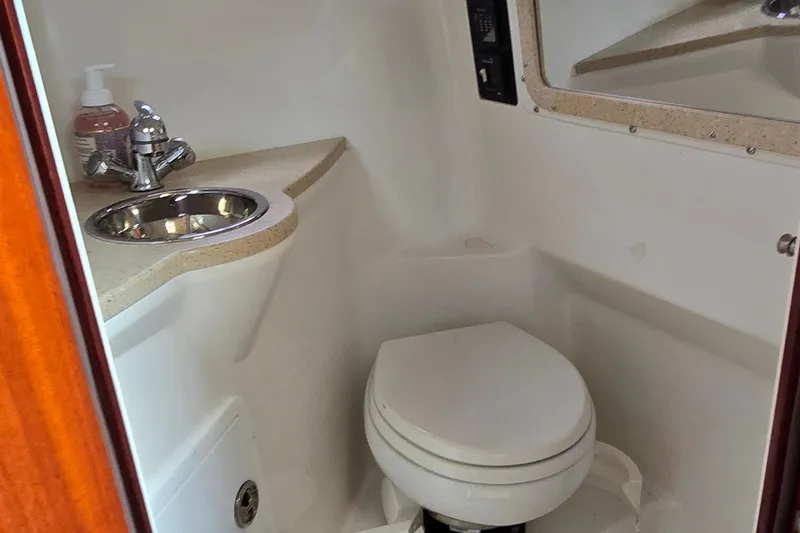  Yacht Photos Pics Compact bathroom in 2011 Cobalt 323 boat with sink and toilet.