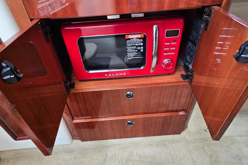  Yacht Photos Pics Red Galanz microwave inside wooden cabinet of 2011 Cobalt 323 boat.
