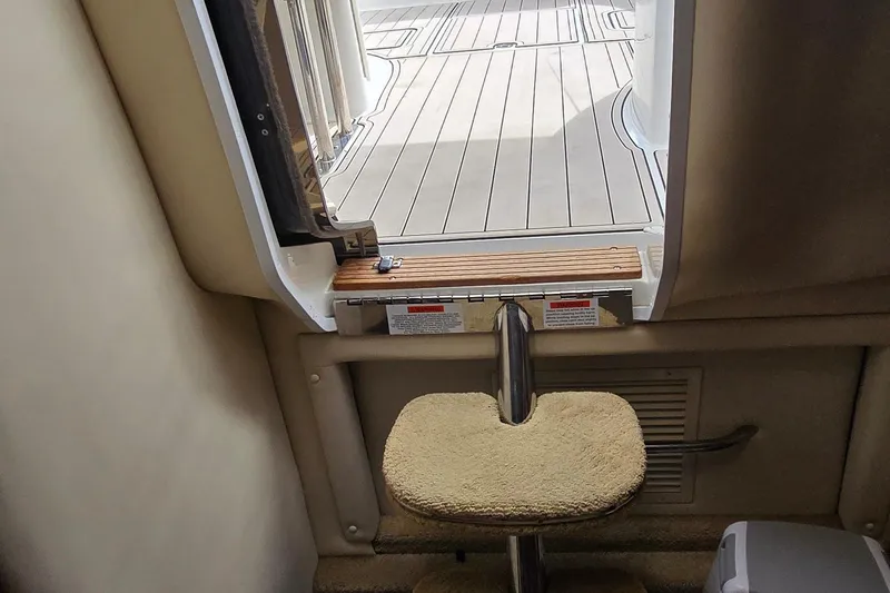  Yacht Photos Pics Interior view of a 2011 Cobalt 323 boat, showing a step and open hatch.