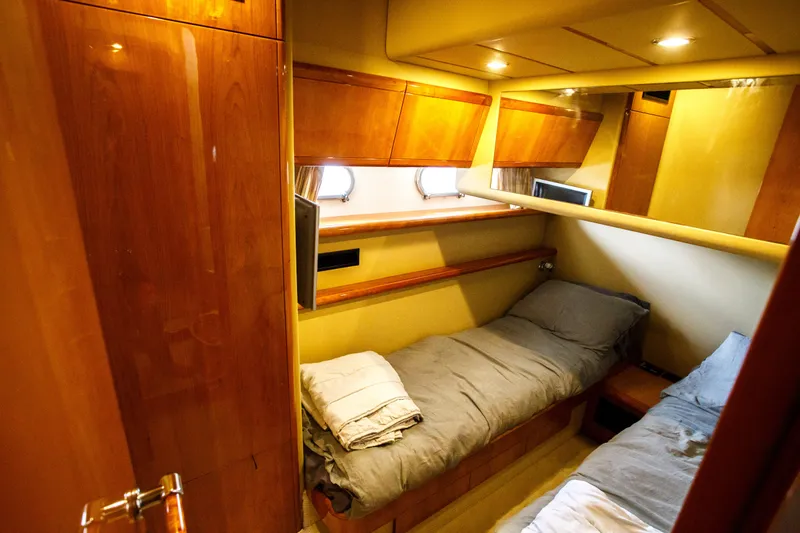 Arion Yacht Photos Pics 2003 Ferretti Yachts 530 cabin with twin beds and wooden interior.