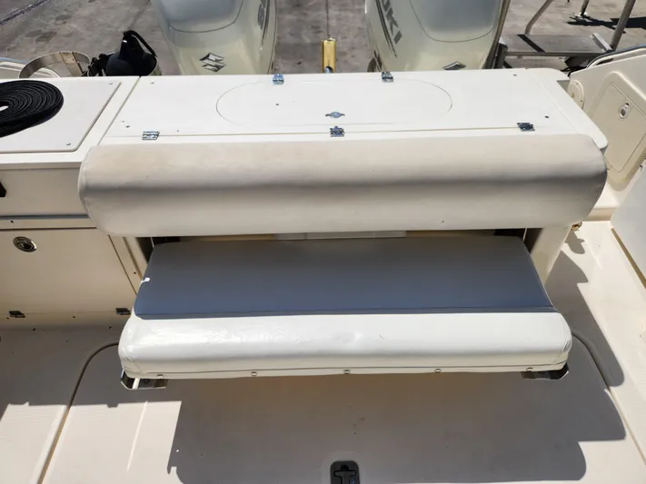 N' Pursuit Yacht Photos Pics 2005 Pursuit 3070 Offshore Center Console boat seat and storage area.