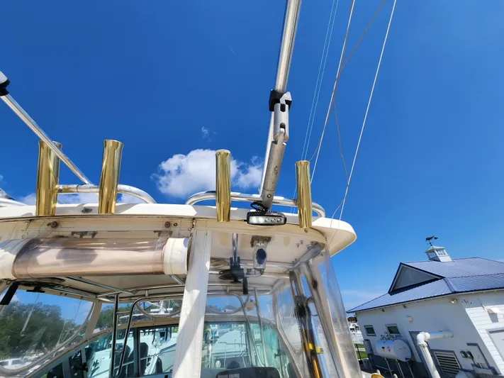 N' Pursuit Yacht Photos Pics 2005 Pursuit 3070 Offshore Center Console boat under clear blue sky.