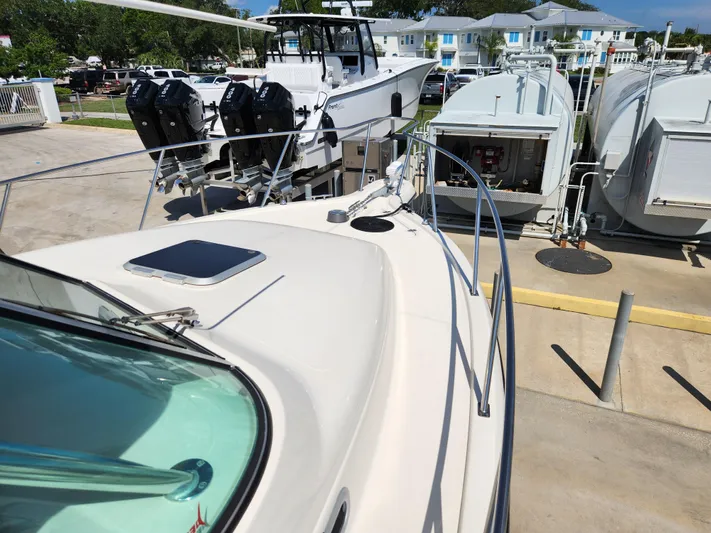 N' Pursuit Yacht Photos Pics 2005 Pursuit 3070 Offshore Center Console boat docked with other vessels nearby.