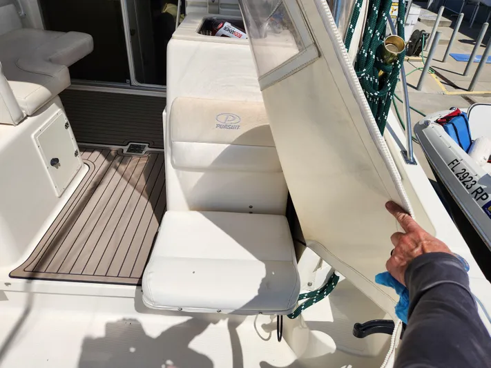 N' Pursuit Yacht Photos Pics 2005 Pursuit 3070 Offshore Center Console boat interior with seating and deck details.