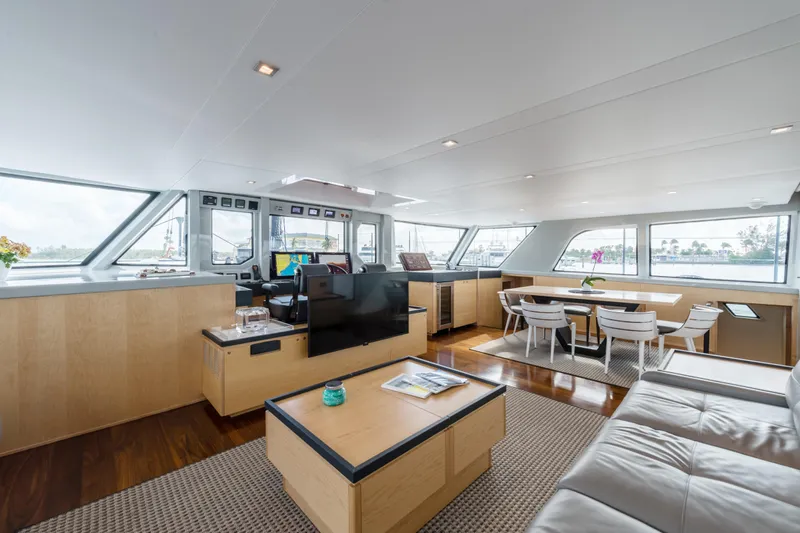 Mycat Yacht Photos Pics Luxurious interior of 2015 Gunboat 78 yacht with modern furnishings and panoramic windows.