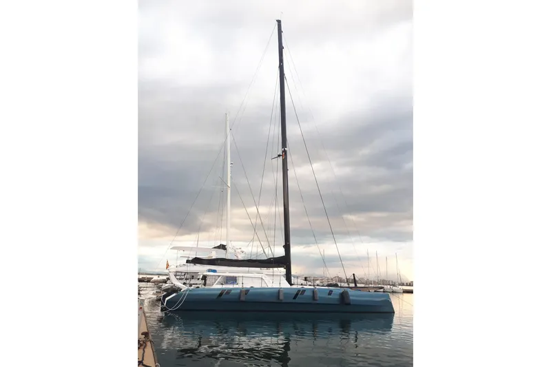 Mycat Yacht Photos Pics Gunboat 78 catamaran, 2015 model, docked at marina under cloudy sky.