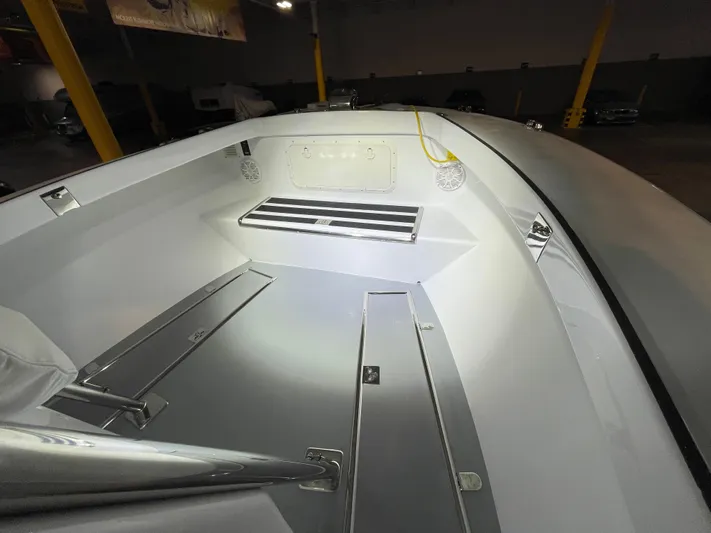  Yacht Photos Pics Interior of a 2017 Custom Carolina Style boat, featuring storage compartments and seating.