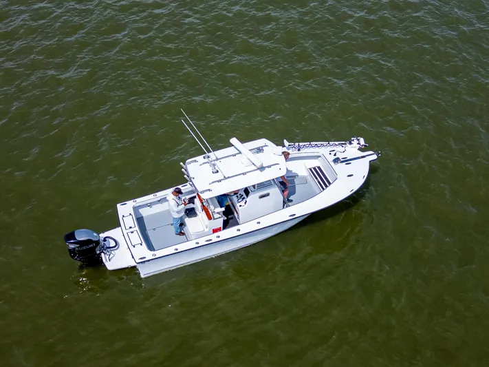  Yacht Photos Pics Aerial view of a 2017 Custom Carolina Style boat on the water.